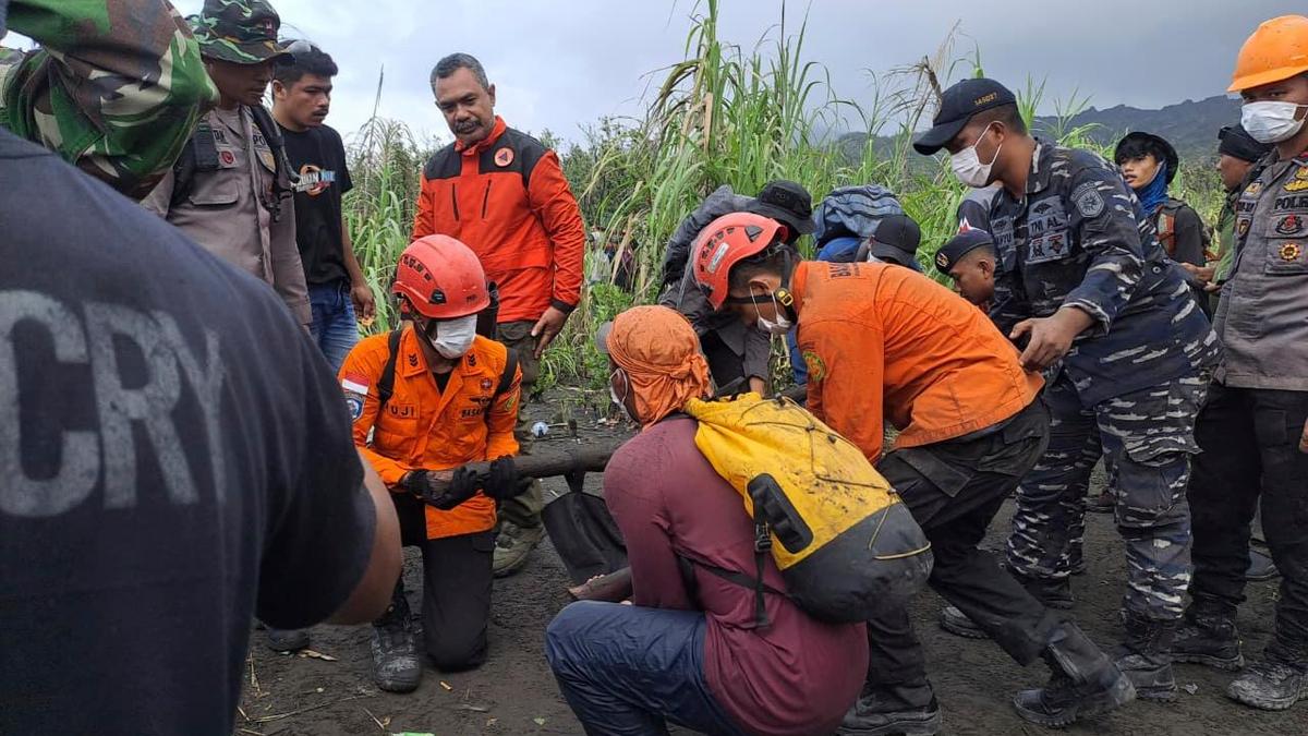 Indonesian rescuers find 1 body after volcano eruption as search continues for 2 more